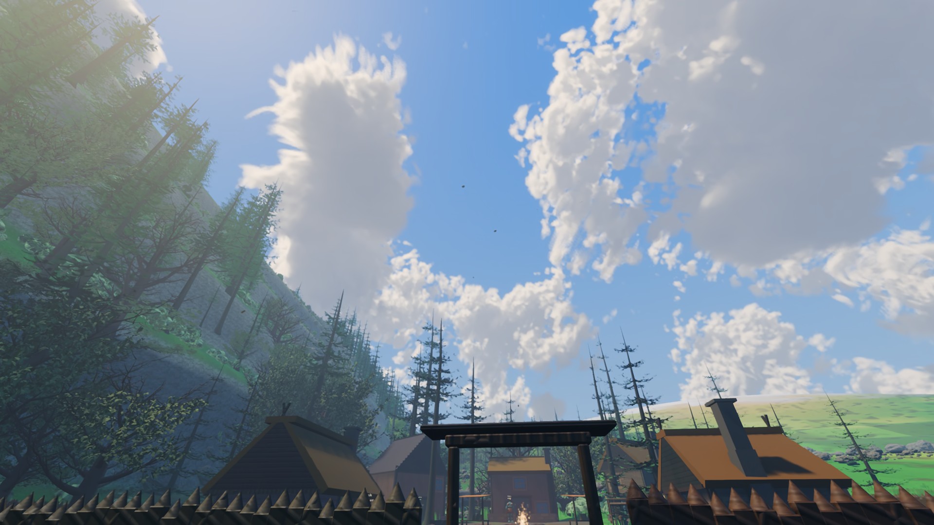 Looking up from the village at noon at scattered volumetric cumulus over a forested hillside