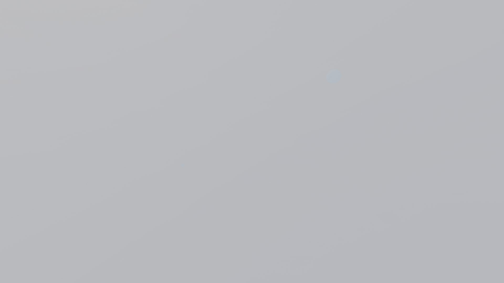 The view from inside a cloud: an even, featureless grey filling the whole frame
