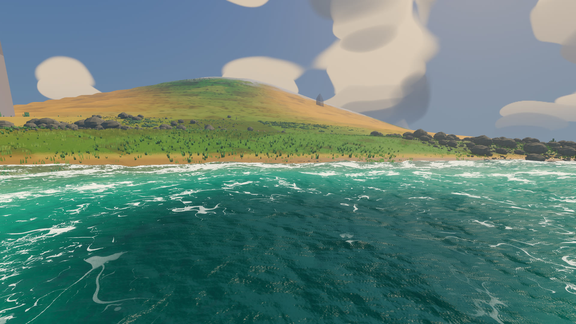 The coast from offshore: a grassy hill over a sand beach, a broken line of surf along the waterline and veined foam on turquoise water