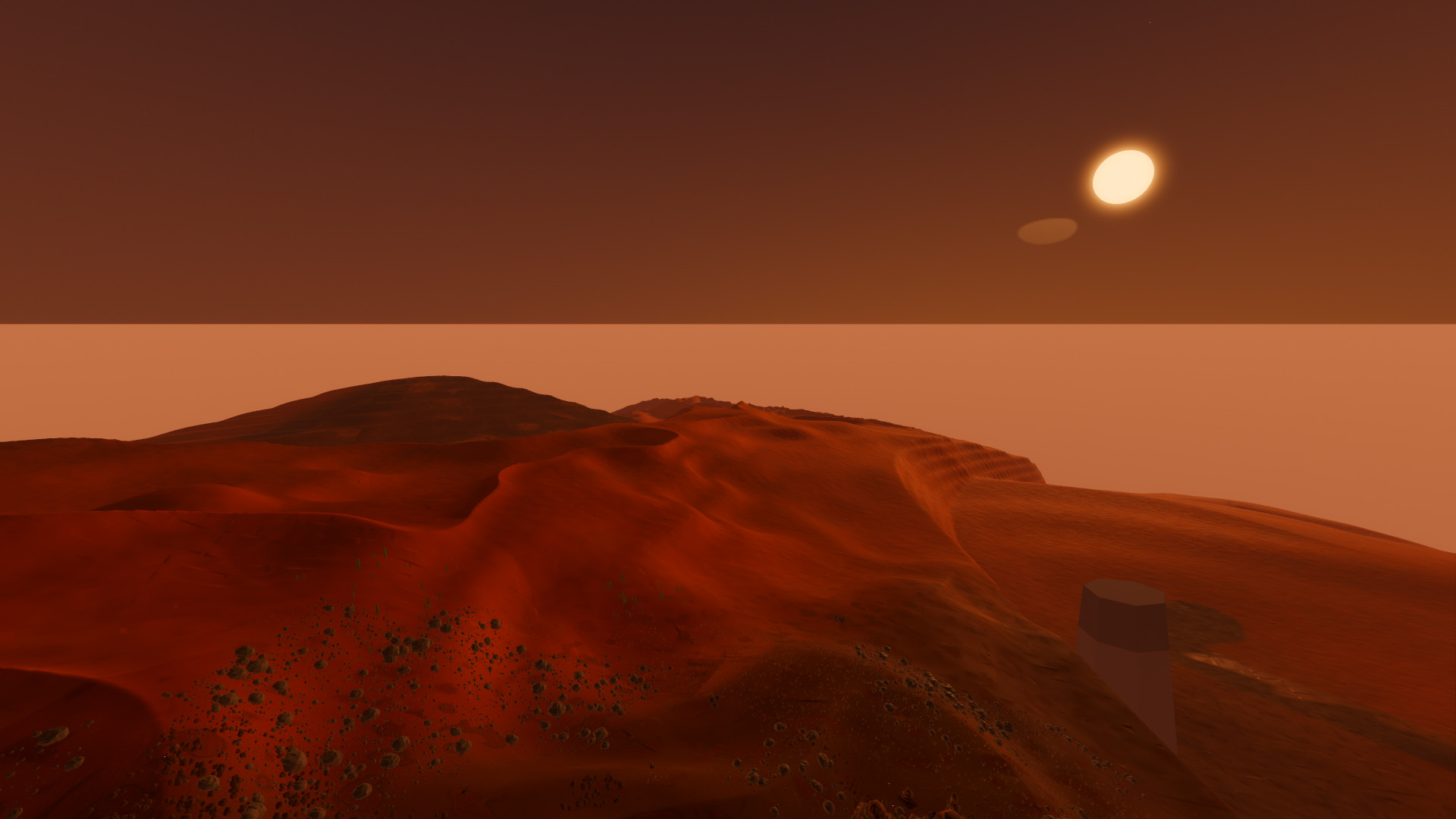 Orange-red dunes under a low sun and a hazy sky, the red-desert demo world seen from the air